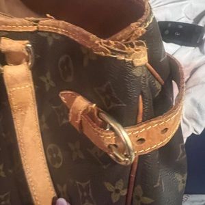 Authentic Louis Vuitton purse with damage to leather trim.